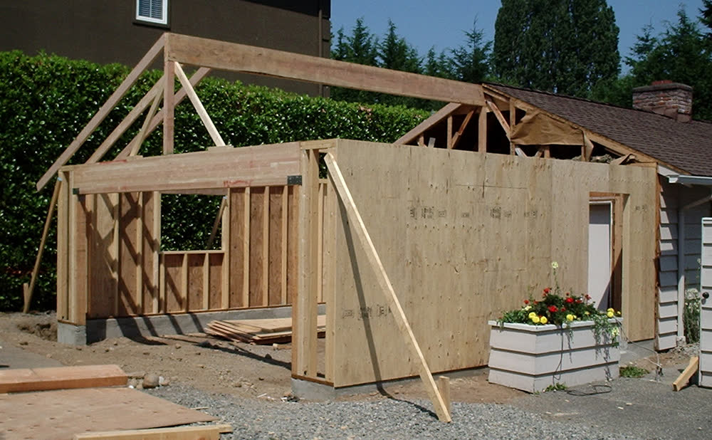 Framing for a new room addition on the side of a house